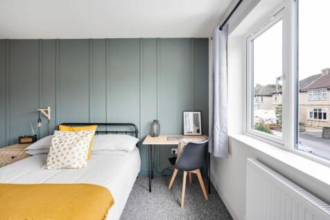 Bright, stylish double bedroom with a comfortab...