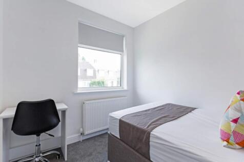 Bright and cozy double bedroom featuring a comf...