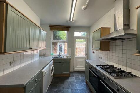 Bright galley kitchen with plenty of storage, f...