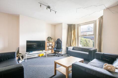 Bright, sociable living area with large bay win...