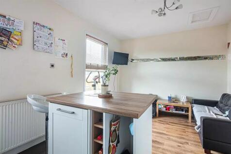 Bright and welcoming living room featuring a mo...