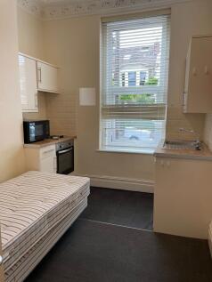 Bright studio space with a large sash window, f...