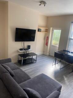 Bright contemporary living room with a large gr...