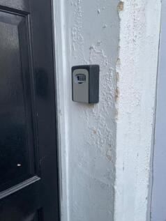 Exterior entryway showing a secure combination ...