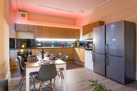 Contemporary fully equipped kitchen with a larg...