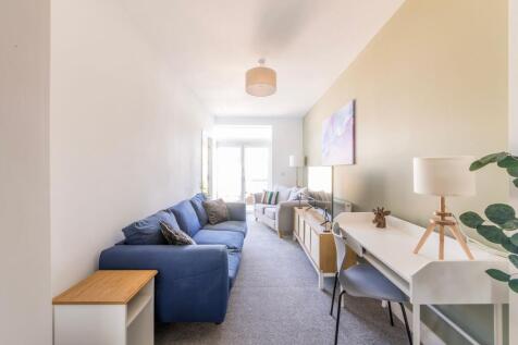 Bright, contemporary living room with comfortab...