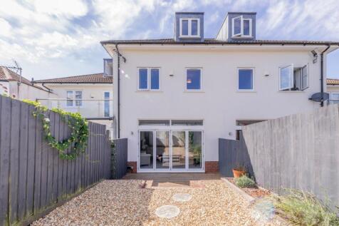 Sunny, low-maintenance private garden with grav...