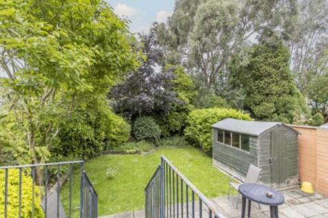 A beautiful, well-maintained garden with lush g...