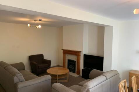 A spacious living room with comfortable seating...