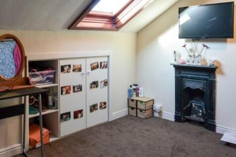 Bright attic double bedroom with a skylight, fi...