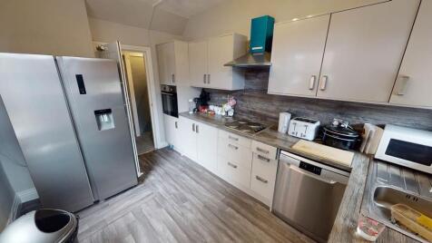 A well-maintained modern kitchen featuring stai...