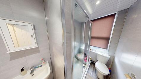 A clean and well-maintained bathroom featuring ...