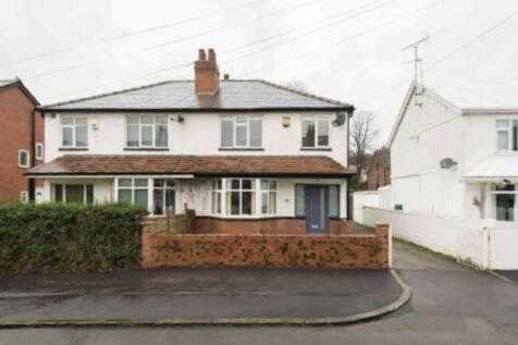 Semi-detached brick-front house with a small wa...