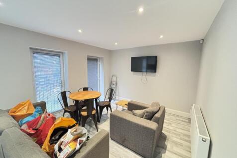 Bright, modern living area with neutral decor, ...