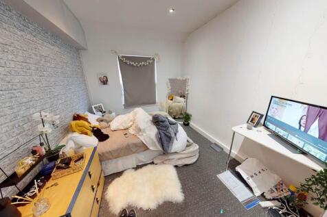 A spacious and inviting living room with ample ...