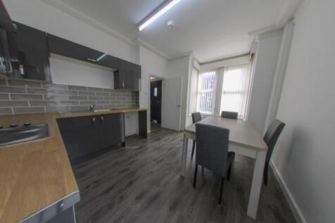 Bright modern kitchen-diner with fitted cupboar...