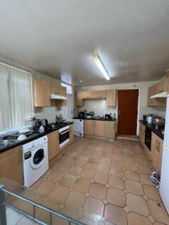 Bright, well-equipped kitchen with ample storag...