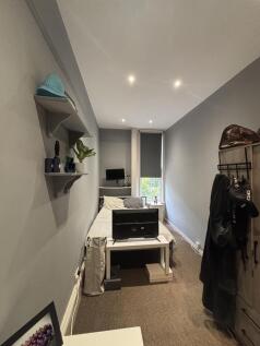 A bright and cozy living room with ample natura...