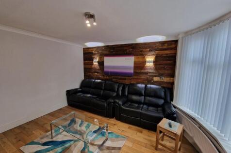 Comfortable contemporary living room with a lea...