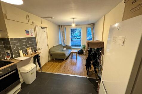 A cozy kitchenette with ample natural light, pe...