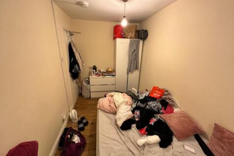 A cozy double bedroom with a personal touch, de...