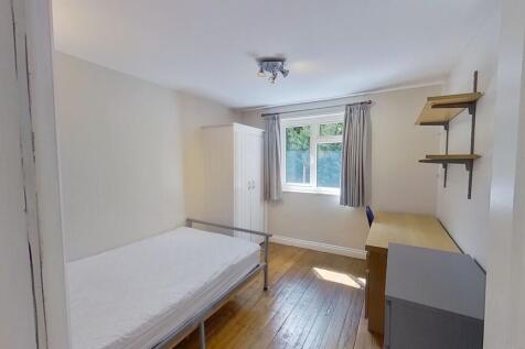 Bright, simply furnished single bedroom with wo...