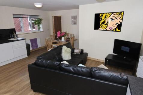 Contemporary open-plan living area with a black...