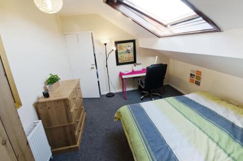 Bright, neatly furnished double bedroom with a ...