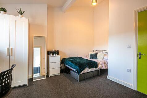 Bright, neatly presented bedroom with a double ...