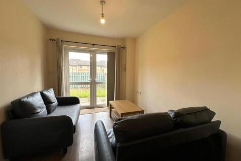 Neat living room with two comfortable leather s...