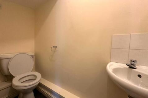 Compact WC with a toilet and corner washbasin; ...