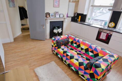 Bright, modern open-plan living area with a col...