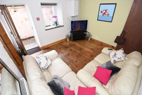 Bright, neatly presented living room with warm ...