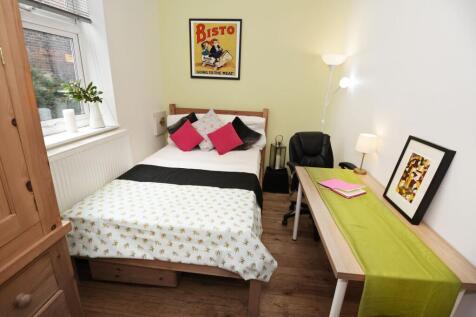 Bright, neatly presented bedroom with a comfort...