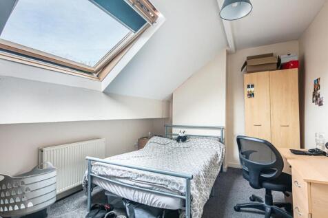 Bright attic double bedroom with a large skylig...