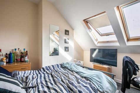 Bright attic double bedroom with sloped ceiling...