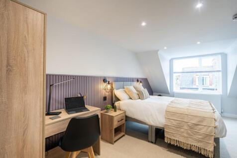 Bright and inviting bedroom with modern decor, ...