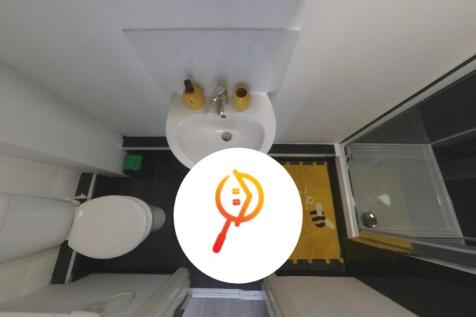 Compact, tidy bathroom with a modern pedestal s...