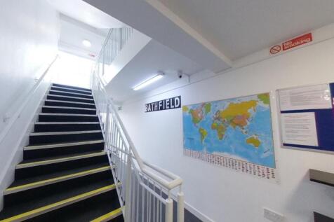 Bright, well-maintained internal staircase with...