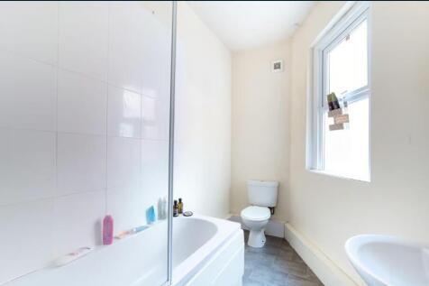 Bright, clean bathroom with a full bath and sho...