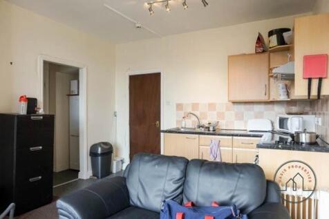 A cozy living room featuring a comfortable sofa...