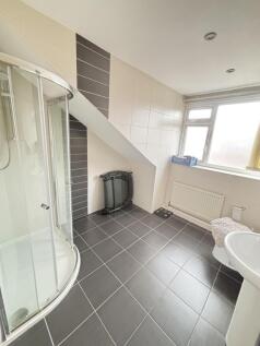 Bright and modern bathroom featuring a spacious...