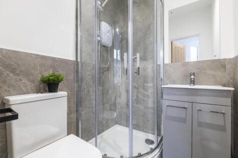 A modern, well-maintained bathroom featuring a ...
