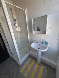 A clean and well-maintained bathroom with a spa...