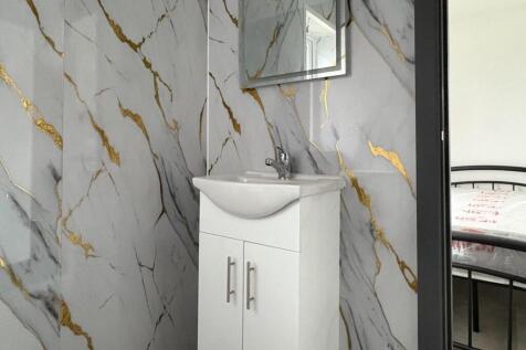 Bright, modern bathroom corner with a stylish w...