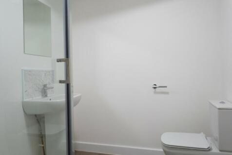 A modern and clean bathroom featuring a stylish...