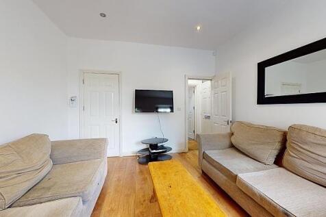 Bright, contemporary living room with hardwood ...