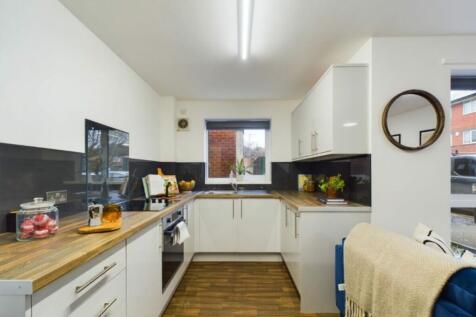 A bright and modern kitchen with ample counter ...