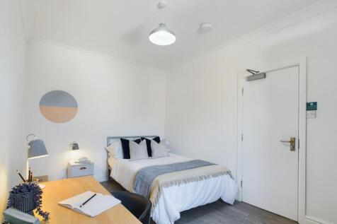 A stylish and inviting double bedroom with ampl...