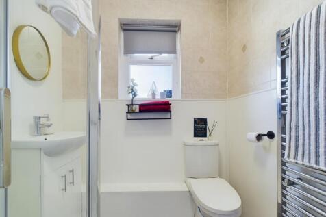 A modern and clean bathroom featuring bright li...